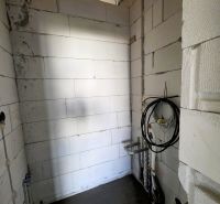 A utility room in a family house with pipe installation.