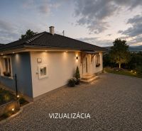 A family house in Ružiná with a landscaped garden and a view of the surrounding nature.