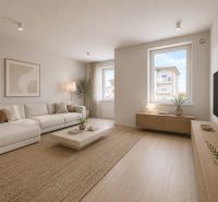 Living room with a cream sofa, wooden decor flooring, and subtle decor.