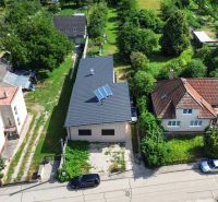 A family house on Sedličná Street in Trenčianske Stankovce, surrounded by greenery and other houses.