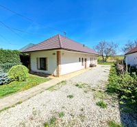 A family house in the town of Tehla on Tehla Street with a landscaped garden and a gravel path.