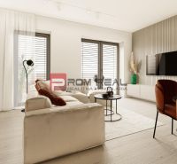 Living room in a three-room apartment with a wooden decor floor and comfortable furniture.