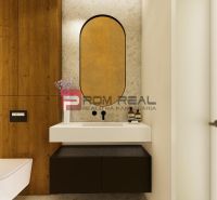 Bathroom in a 4-room apartment with a large mirror and a floor with a wooden decor.