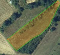 Aerial view of agricultural and forest land near Krupina with green borders.