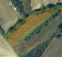 Agricultural and forest lands near Krupina, bordered by a green line in nature.