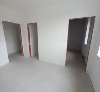 Interior of a 2-room apartment with unfinished walls and empty rooms for renovation.