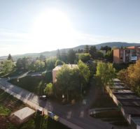 Sunny view of the green surroundings and apartments on Hviezdoslavova Street in Veľký Krtíš.