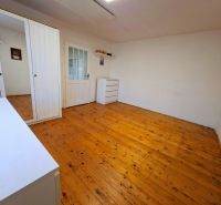 White wardrobe and wooden decor flooring in a family house.