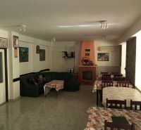 Dining rooms in hotels and guesthouses with a fireplace, sofa, and decorations on the walls.
