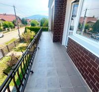 Balcony on a family house on Agátová Street in Čaňa with a metal railing.