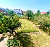 The garden at the family house on Agátová Street in Čaňa with fruit trees and flower beds.