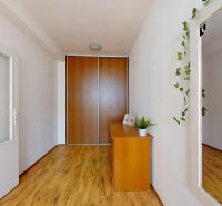 In the 2-room apartment on K výstavisku street, there are wooden floors, wardrobes, and a mirror.