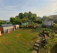 A garden at a family house on Hlavná Street in Lehota with a gazebo and plants.