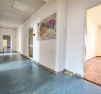 A hallway in offices with a displayed map, wooden decor flooring at Odborárske námestie.