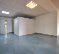 Offices with a simple interior and ceiling lights, floor with blue decor.