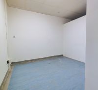 Offices with white walls and blue flooring.