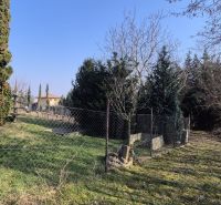 Green plot with a fence near the cottage in Štitáre, on Pri Kaplnke street.