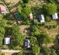 Aerial view of the arrangement of cottages in the green landscape near Banská Bystrica.