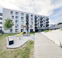 Apartment building on Sibírska Street in Prešov with a children's playground and benches.
