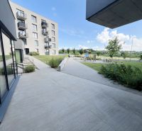 Modern apartment complex on Sibírska Street in Prešov with greenery and a playground.
