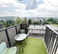 The balcony of a one-room apartment on Sibírska Street in Prešov with a view of greenery.