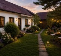 A family house in Kosorín surrounded by a garden, illuminated path, and garden furniture.