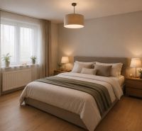 A bedroom in a family house with a bed and a wooden decor floor.