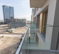 View from the balcony, Bratislava - Old Town, Bottova, with modern architecture and a construction site.