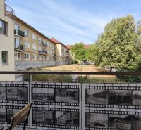 A balcony with a view of the greenery surrounding the 2-room apartment on Okružná Street, Veľký Krtíš.