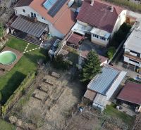 A family house in Trnava on Krajná Street with a swimming pool and a garden with raised beds.