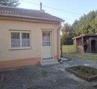 A family house on Krajná Street in Trnava with a yard and an outdoor fireplace.