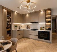 A kitchen in a 3-room apartment with elegant lighting and a wooden decor floor.