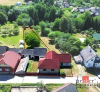 Aerial view of a family house in Kosorín with an adjacent garden and surrounding landscape.