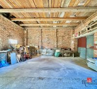 A brick garage building in a family house in Kosorín with diverse storage space.