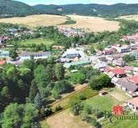 A family house in Kosorín surrounded by nature and nearby houses in a picturesque setting.