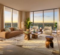 Bright living room with large windows, comfortable seating, and a carpet.