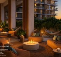 An outdoor space in Miami with comfortable seating by the fire pit and plants.