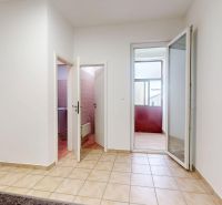 Interior of a 3-room apartment with tiles and open doors to the bathroom.