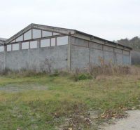 The exterior of warehouses and halls in Trnava, surrounded by a natural environment.