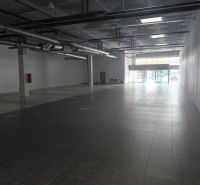 Spacious commercial spaces with large windows and high ceilings.