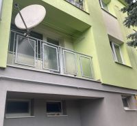 The facade of a 3-room apartment in Volkovce with a balcony and a satellite dish.