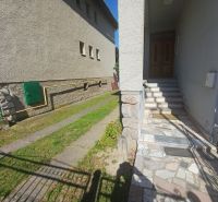 Entrance to a family house in Rožňava with stairs and a paved terrace.