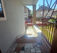 Entrance hall of a family house in Rožňava with a view of the street and garden.