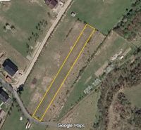 Aerial view of recreational plots in Lysice, bordered by a yellow line.