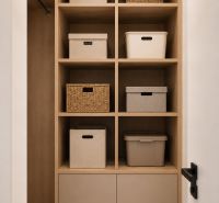 Storage space in a 2-room apartment with shelves and organizers.