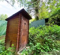 A wooden latrine near a cabin in the natural environment of Bratislava IV.