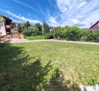 Recreational plots in Bžany at Valkov with grassy areas and surrounding greenery.
