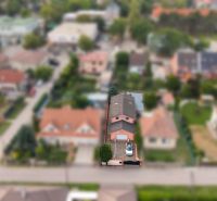 A family house in Bernolákovo with a parking lot and a garden, surrounded by other houses.