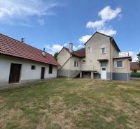 A family house in Dojč on Hoštáky Street with a grassy yard and an annex.
