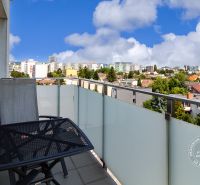 The balcony of a 2-room apartment on Hraničná Street in Bratislava - Ružinov with a city view.